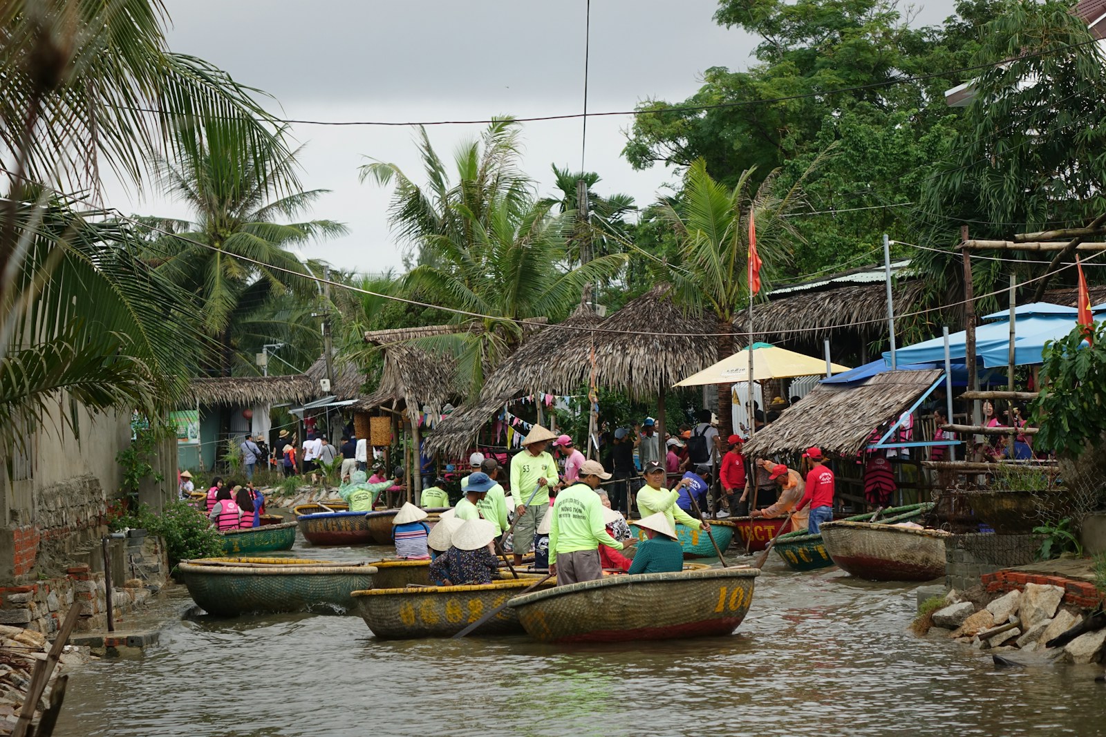A group of people in small boats on a river