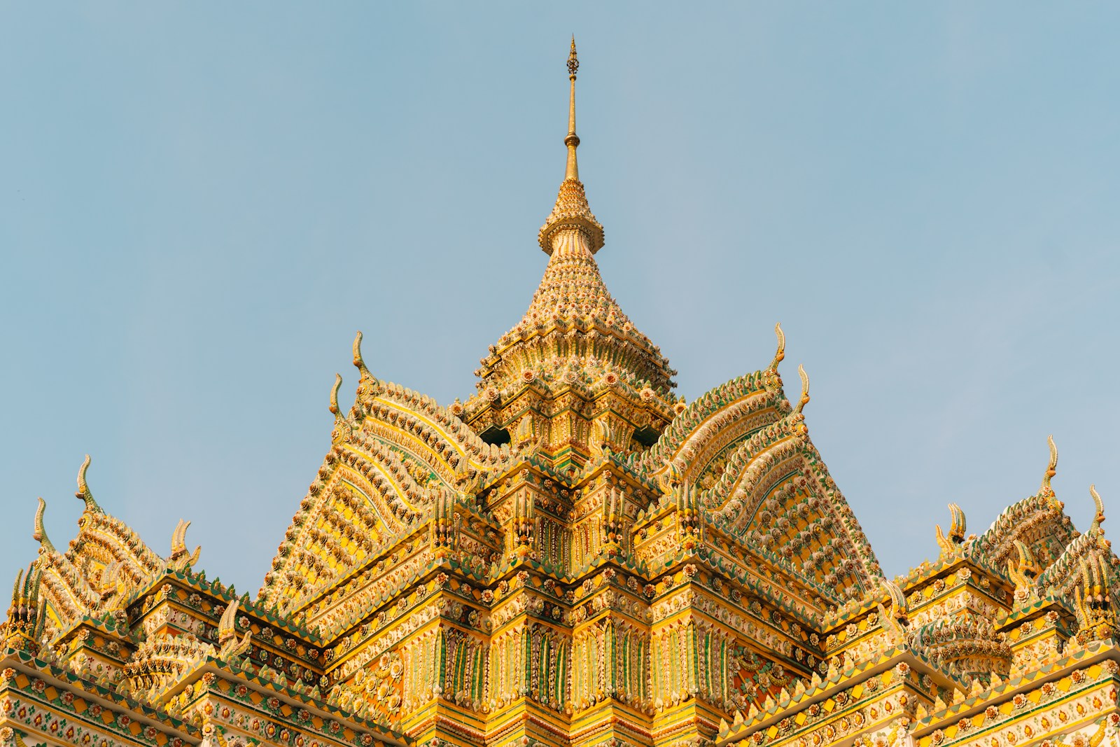 Ornate buddhist temple against a clear sky.